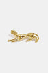 Gold-colored cheetah brooch with clear rhinestones, lying down.