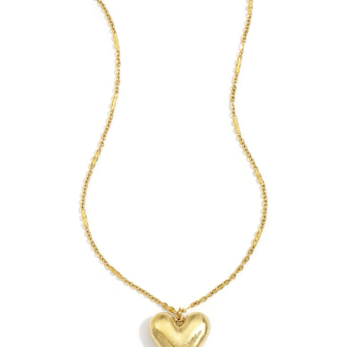 Gold heart pendant necklace with an adjustable clavicle chain.