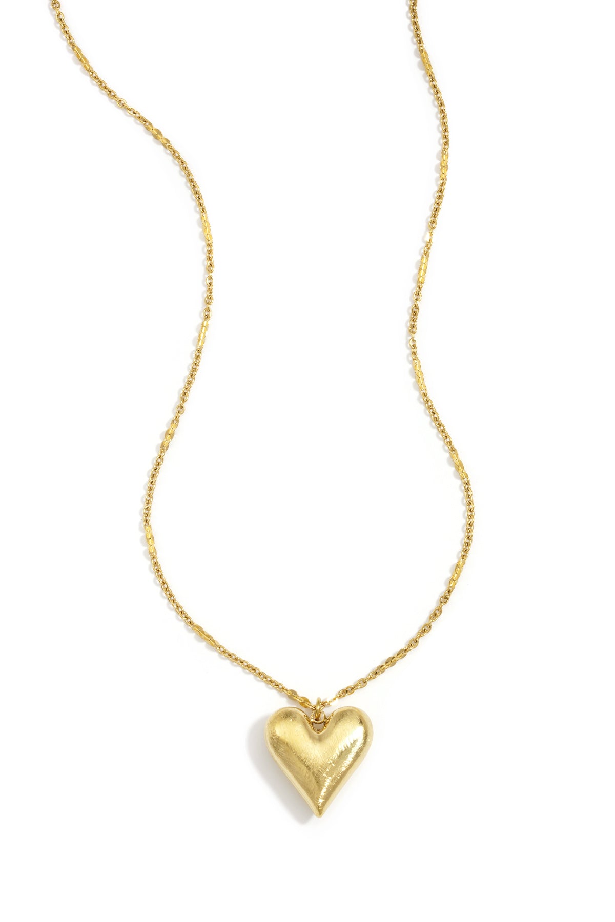 Gold heart pendant necklace with an adjustable clavicle chain.